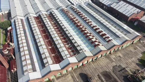 Aerial view flying over old industrial warehouse Video stock 339304620
