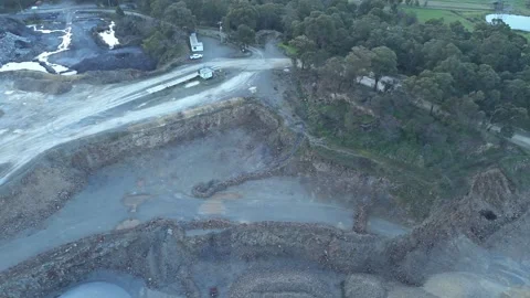 Aerial view flying over an open-pit mine quarry Vídeos de archivo 342514636