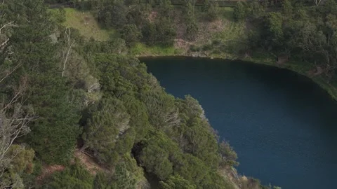 Aerial view flying over a pristine mountain lake Stock Footage 339377014