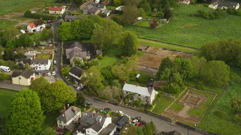 Aerial view flying over a quaint english village 스톡 동영상 336809577