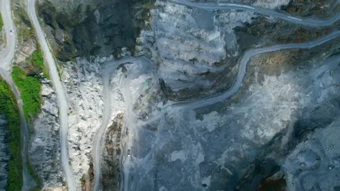 Aerial view flying over a quarry in the tropical Stock Footage 210784142