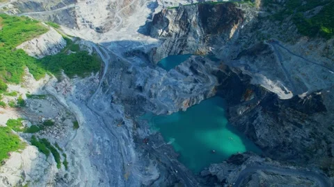 Aerial view flying over a quarry in the tropical Stock Footage 210786358