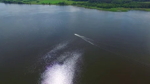 Aerial View. Flying over the river and motor boat - 002 Stock Footage 73052195