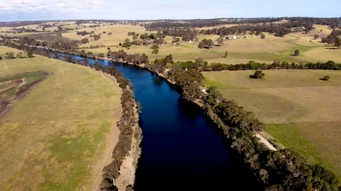 Aerial View Flying Over River and Farm Land Stock Footage 99018282
