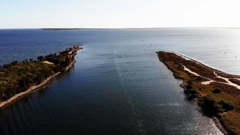 Aerial View Flying Over River towards Lake with end of Land Stock Footage 99018312
