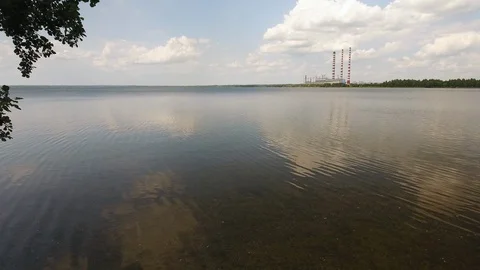 Aerial View. Flying over the river trees near the power plant. Stock Footage 109460085