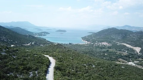 Aerial view. Flying over the road towards the Brijesta, Croatia Stock Footage 94586359