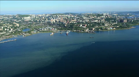 Aerial View. Flying over the seacoast. Harbor of the Vladivostok city. Stock Footage 34697179