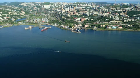 Aerial View. Flying over the seacoast. Harbor of the Vladivostok city. Stock Footage 34697201