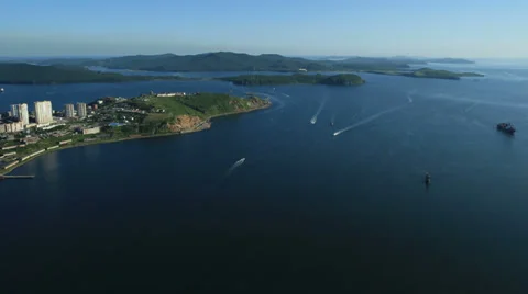Aerial View. Flying over the seacoast. Harbor of the Vladivostok city. Stock Footage 34697927