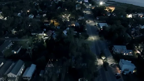 Aerial view flying over small town at night Stock Footage 239016795