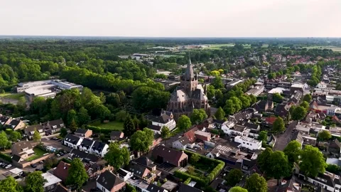 Aerial view flying over a small european town with a church Vídeo Stock 336594774