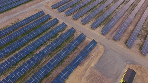 Aerial View. Flying over the solar power plant with sun. Solar panels and sun. Stock Footage 65174151