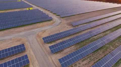 Aerial View. Flying over the solar power plant with sun. Solar panels and sun. Stock Footage 65174204
