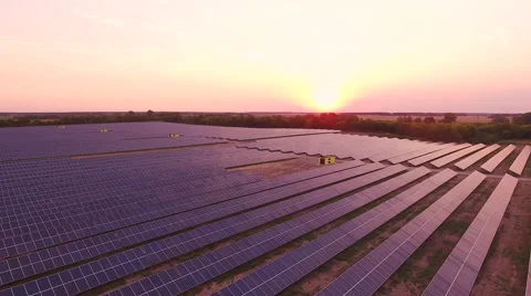 Aerial View. Flying over the solar power plant with sun. Solar panels and sun. Stock Footage 65174228