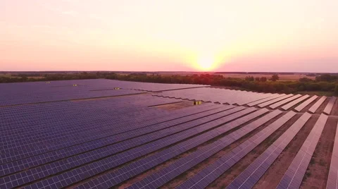 Aerial View. Flying over the solar power plant with sun. Solar panels and sun. Stock Footage 65174256