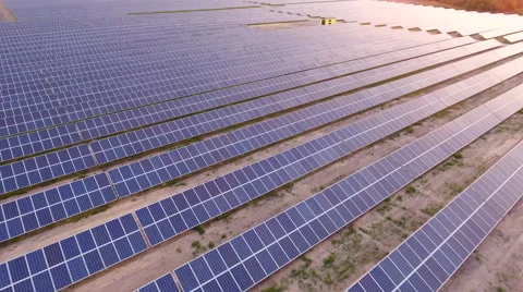 Aerial View. Flying over the solar power plant with sun. Solar panels and sun. Stock Footage 65174338