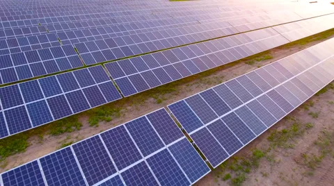 Aerial View. Flying over the solar power plant with sun. Solar panels and sun. Stock Footage 65174418