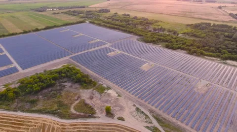 Aerial View. Flying over the solar power plant with sun. Solar panels and sun. Stock Footage 65174441