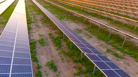 Aerial View. Flying over the solar power plant with sun. Solar panels and sun. Stock Footage 65174705