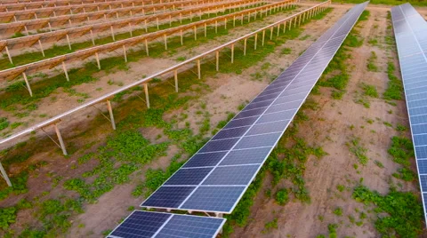 Aerial View. Flying over the solar power plant with sun. Solar panels and sun. Stock Footage 65174775