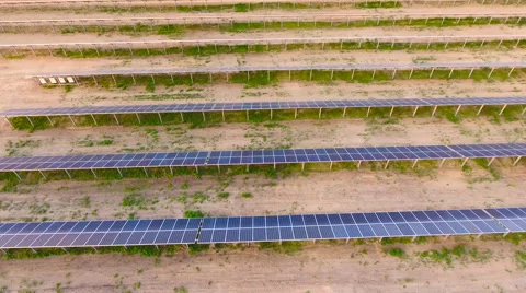 Aerial View. Flying over the solar power plant with sun. Solar panels and sun. Stock Footage 65174883