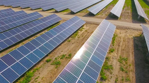 Aerial View. Flying over the solar power plant with sun. Solar panels and sun. Stock Footage 65175426