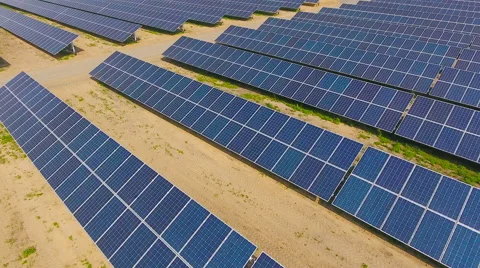 Aerial View. Flying over the solar power plant with sun. Solar panels and sun. Stock Footage 65175550