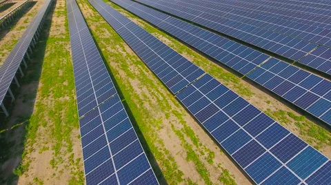 Aerial View. Flying over the solar power plant with sun. Solar panels and sun. Stock Footage 65175603