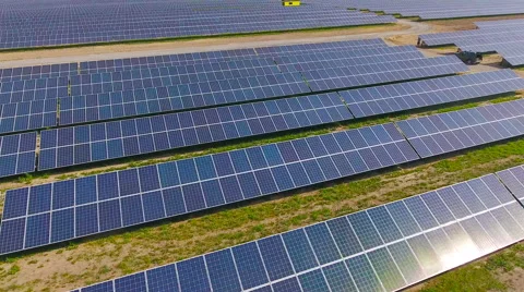 Aerial View. Flying over the solar power plant with sun. Solar panels and sun. Stock Footage 65175737