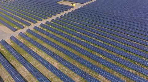 Aerial View. Flying over the solar power plant with sun. Solar panels and sun. Stock Footage 65237893