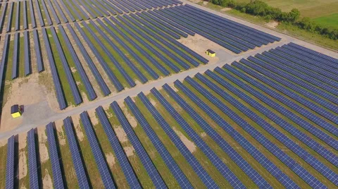 Aerial View. Flying over the solar power plant with sun. Solar panels and sun. Stock Footage 65238047