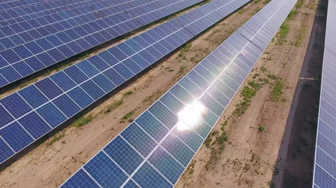 Aerial View. Flying over the solar power plant with sun. Solar panels and sun. Stock Footage 65238347