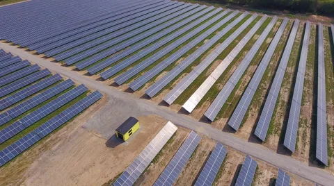 Aerial View. Flying over the solar power plant with sun. Solar panels and sun. Stock Footage 65238395