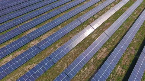 Aerial View. Flying over the solar power plant with sun. Solar panels and sun. Stock Footage 65238516