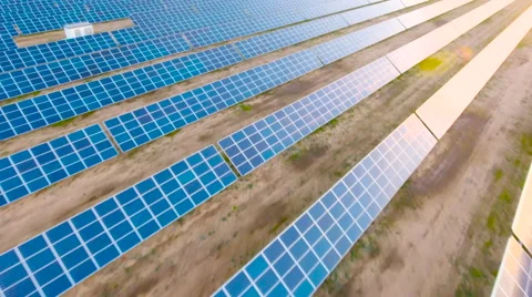 Aerial View. Flying over the solar power plant with sun. Solar panels and sun. Stock Footage 69033503