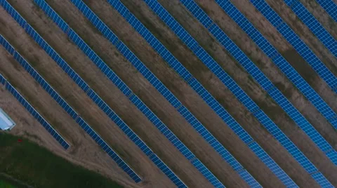 Aerial View. Flying over the solar power plant with sun. Solar panels and sun. Stock Footage 69035337