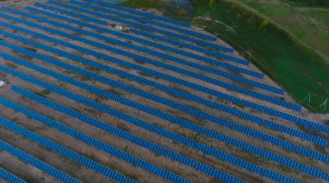 Aerial View. Flying over the solar power plant with sun. Solar panels and sun. Stock Footage 69036610