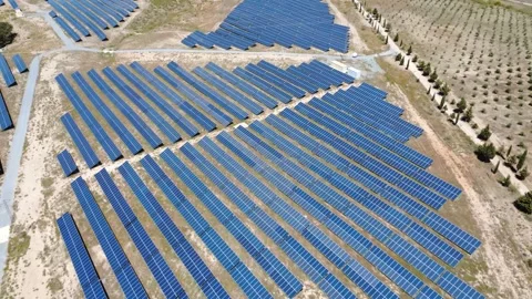 Aerial view flying over a solar farm generating renewable energy Stock Footage 337037668
