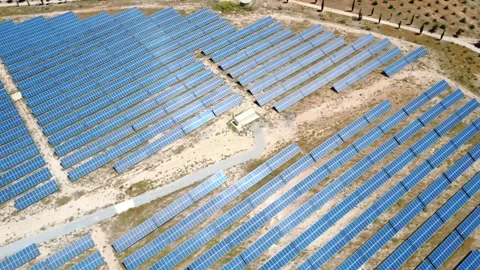 Aerial view flying over solar panels farm Stockbeeldmateriaal 338196977