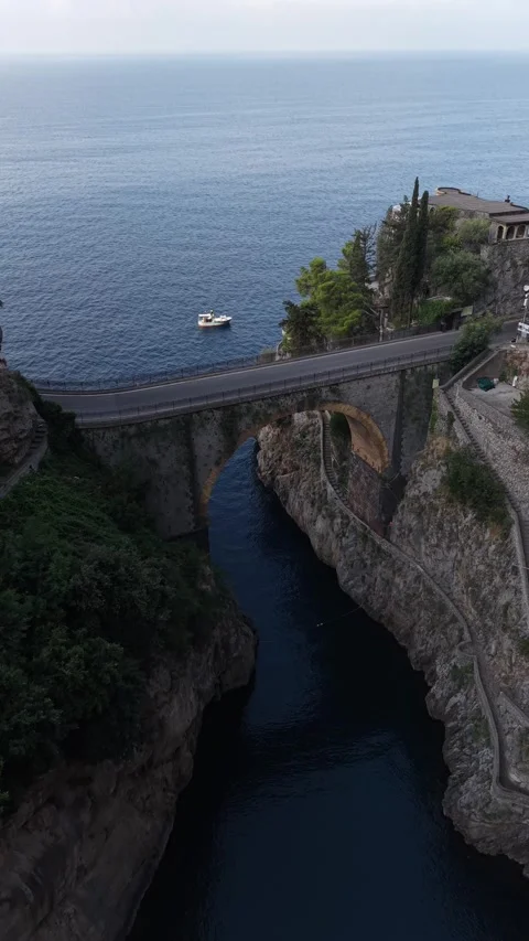 Aerial view flying over the stunning amalfi coast with the fiordo di furore Stock Footage 340149652