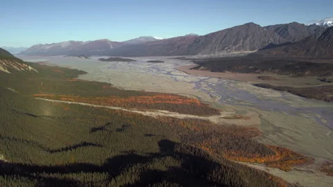 Aerial view flying over a vast alaskan river valley and mountains Stock Footage 335106508