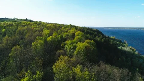 Aerial view flying over Vitachiv village hills near Dnipro river at sunset Vídeos de archivo 129054777