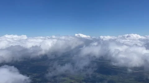 Aerial view flying though the clouds over London Stock Footage 276385976