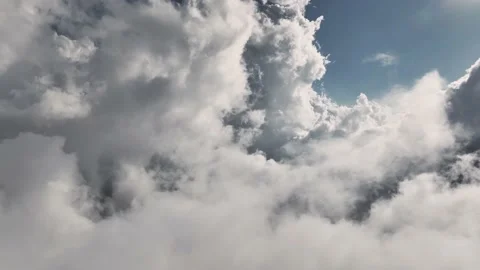 Aerial view Flying through beautiful thick fluffy clouds. Amazing timelapse of Stock Footage 203811293