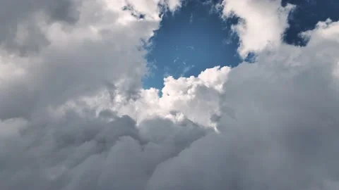 Aerial view Flying through beautiful thick fluffy clouds. Amazing timelapse of Stock Footage 204858288