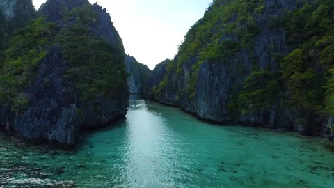 Aerial view flying through big lagoon in el nido palawan philippines Stock Footage 342575503