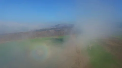 Aerial View Flying Through Clouds Over Field Stock Footage 129269058