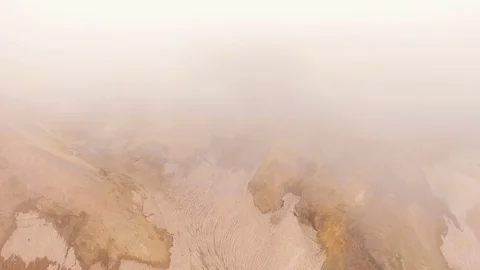 Aerial View. Flying through a gorge in the mountains with snow Stock Footage 72997139