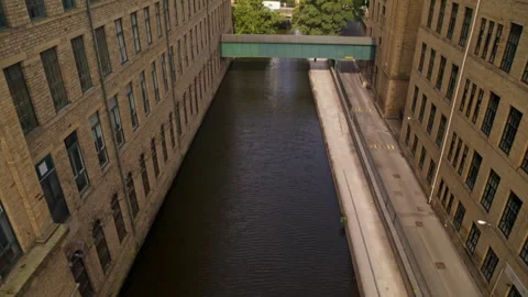 Aerial view flying through an industrial urban canyon Stock-Footage 336798939